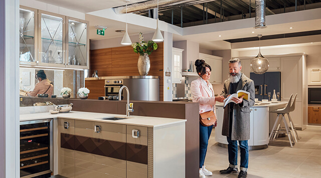 Customers in a kitchen furniture shop