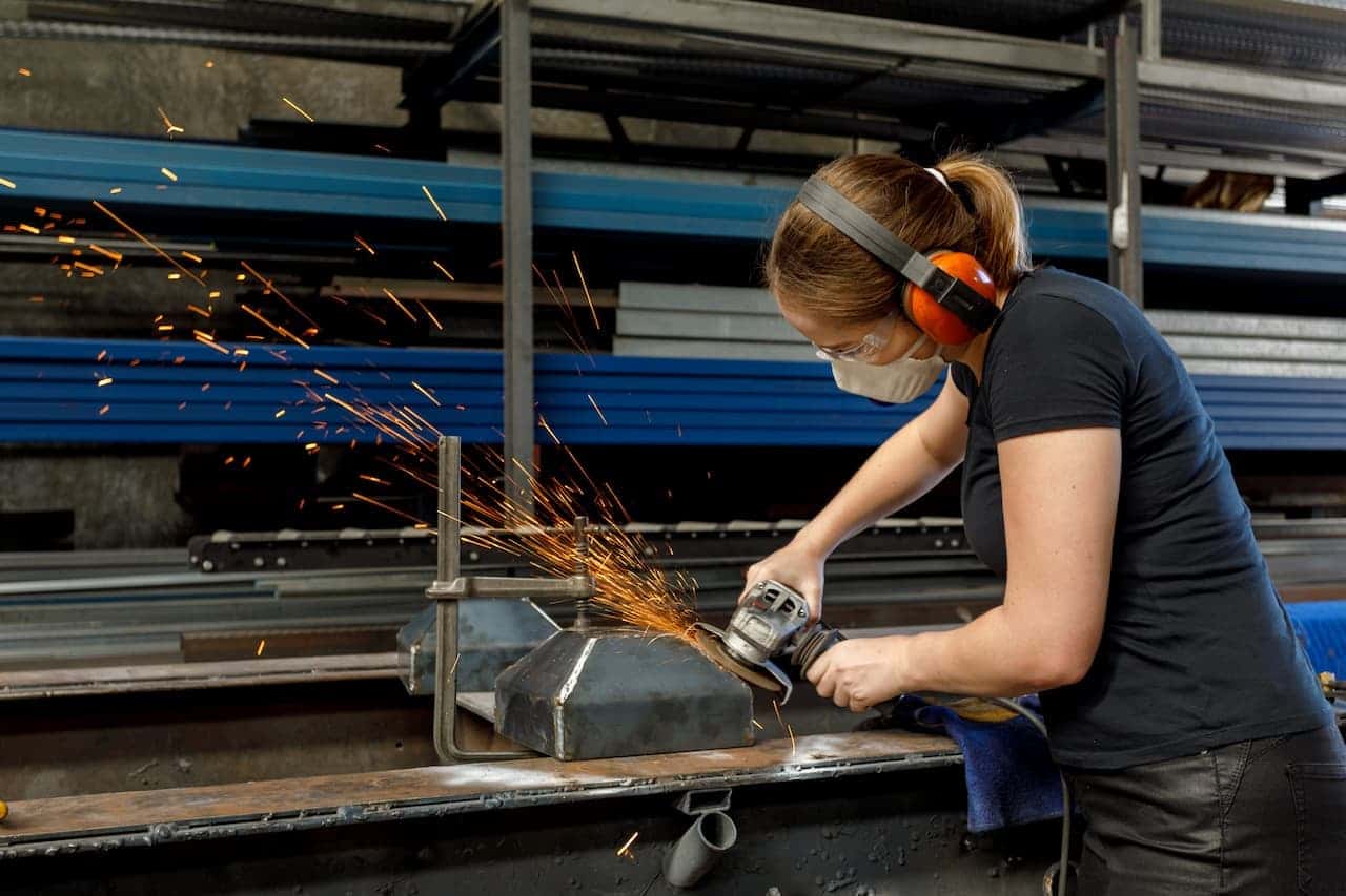 Person using cutting equipment in a workshop