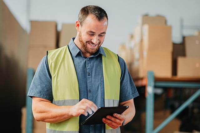 Warehouse worker using a tablet