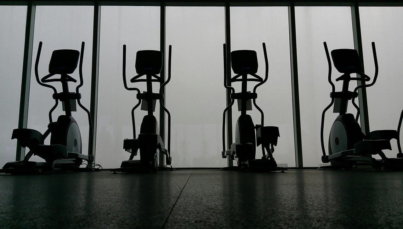 Cross trainers in a dark gym
